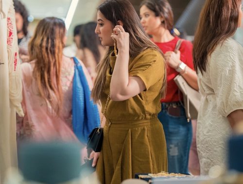 Guests browsing accessories at The Pop Up Story